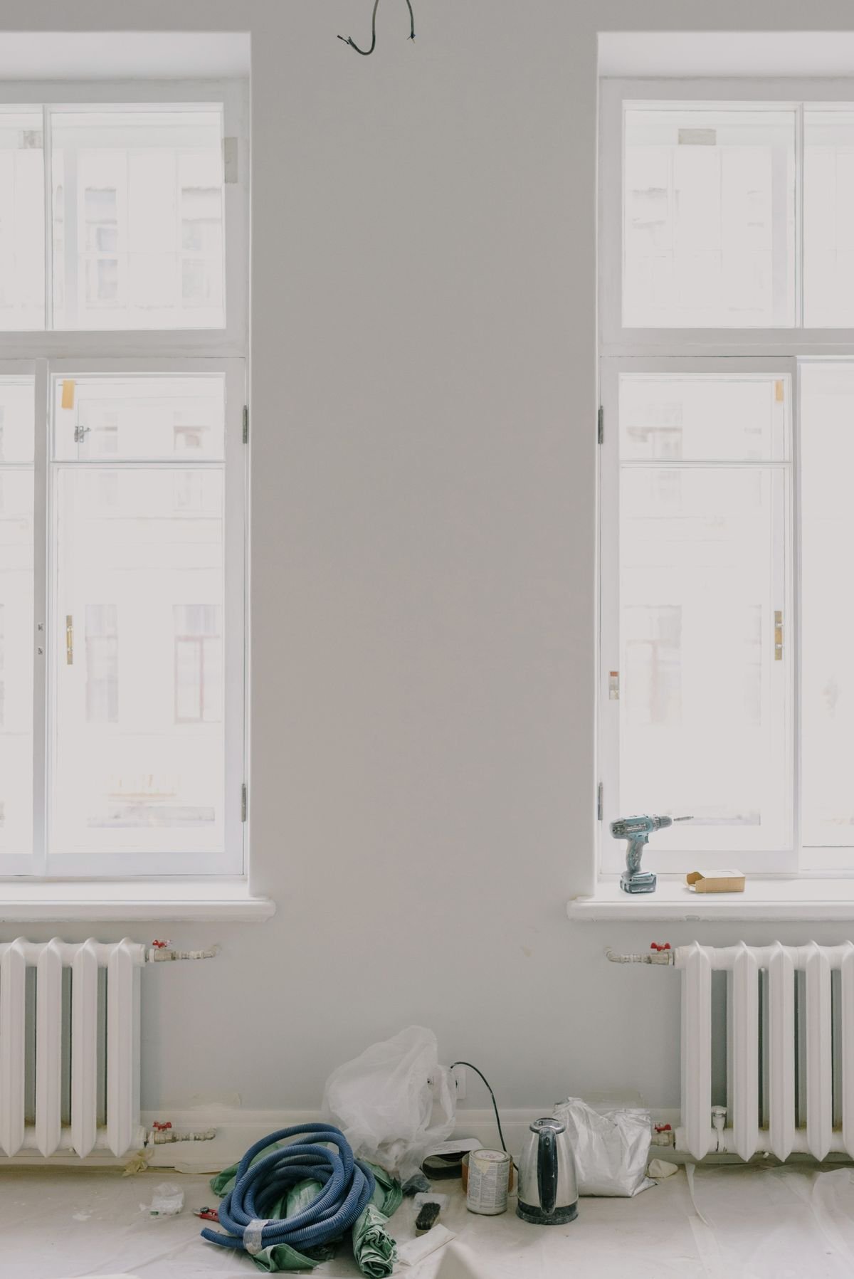 Old windows removed from their hinges during a replacement job