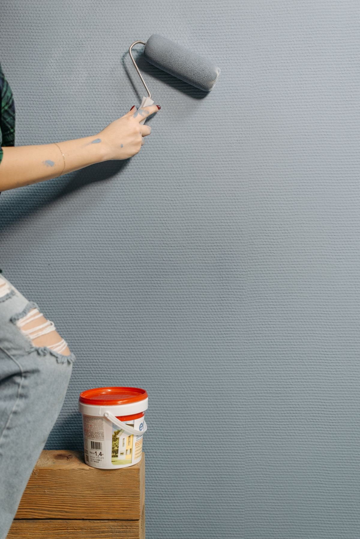 Professional painting the interior of a room