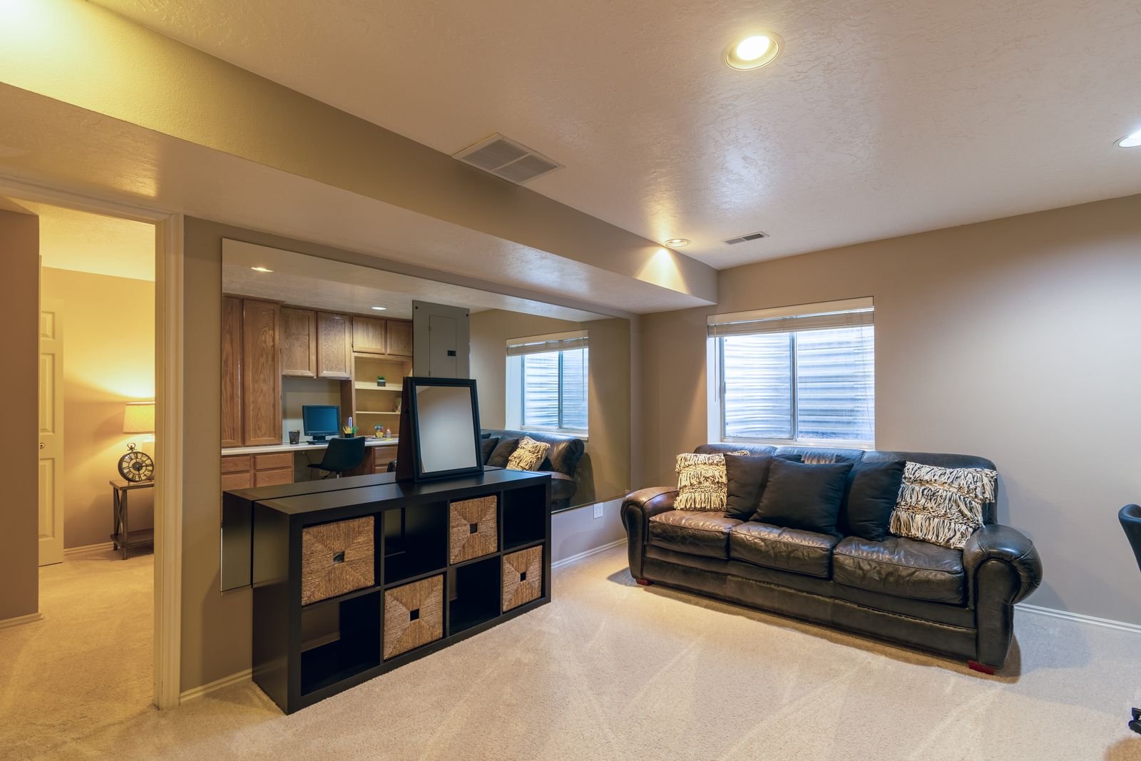 An unfinished basement with a concrete floor and block walls