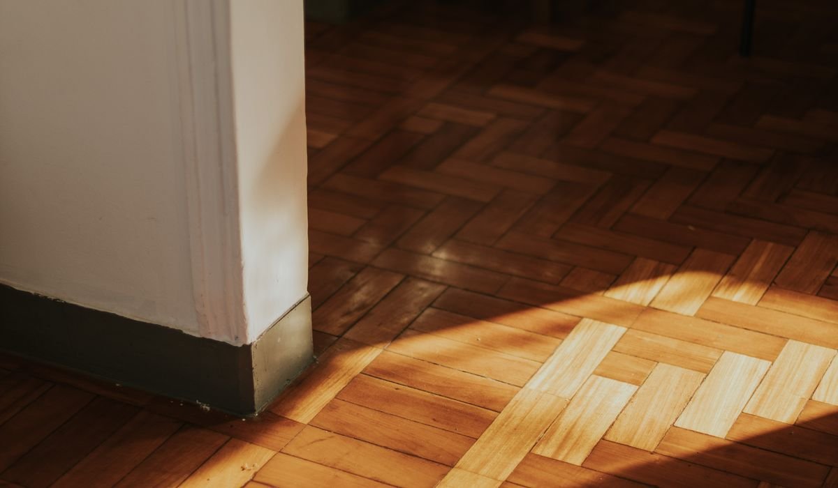 Plank flooring surface showing wear at the seams
