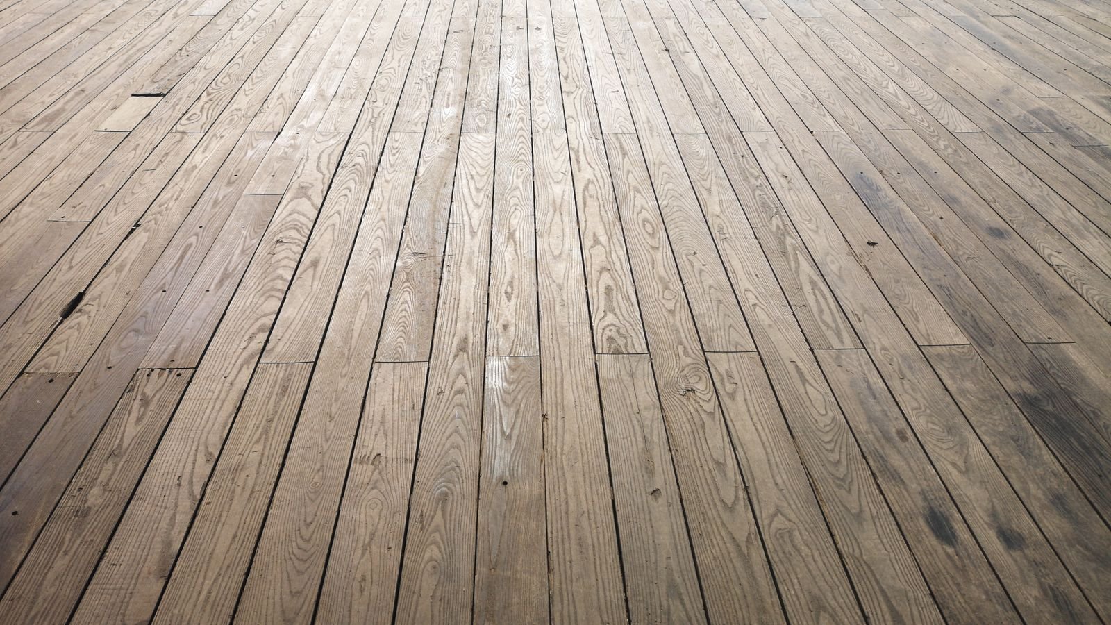 Close view of wood-look plank flooring showing the joints between boards