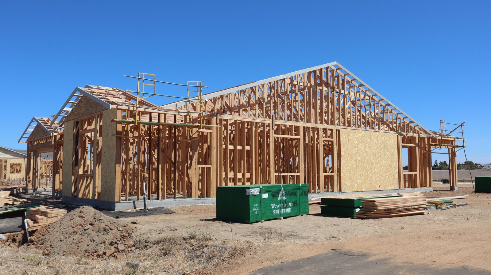 Carpenters framing the walls of a new residential addition