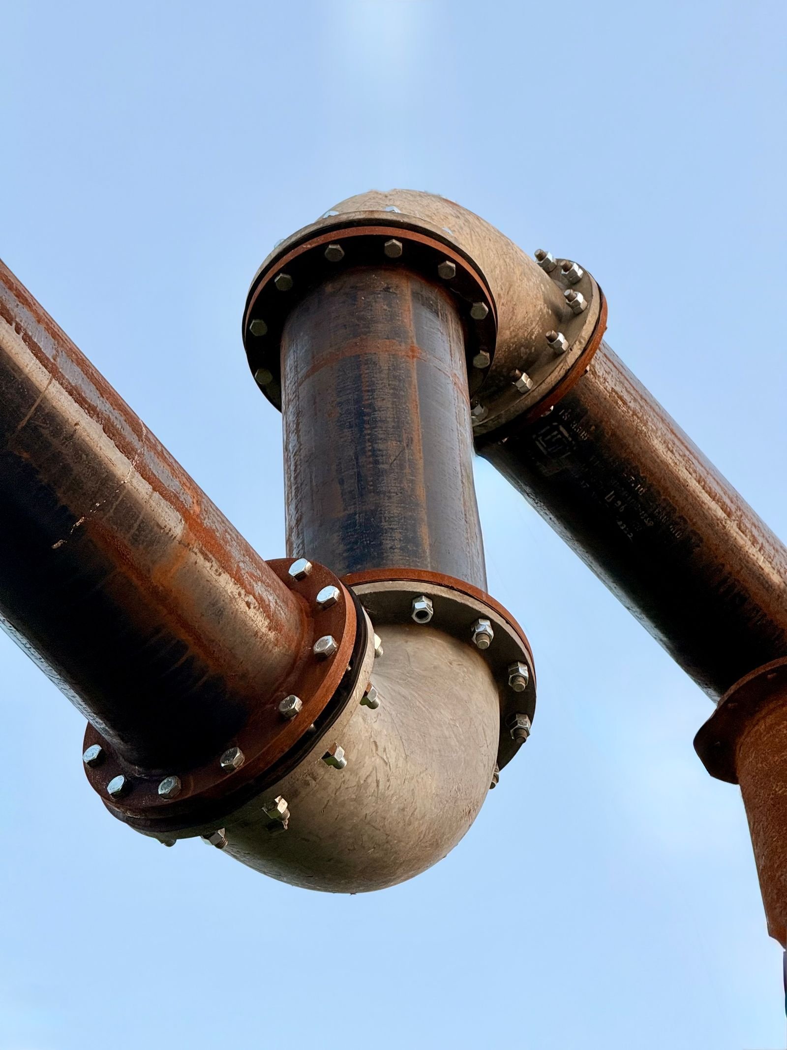 White PVC pipework running through a building
