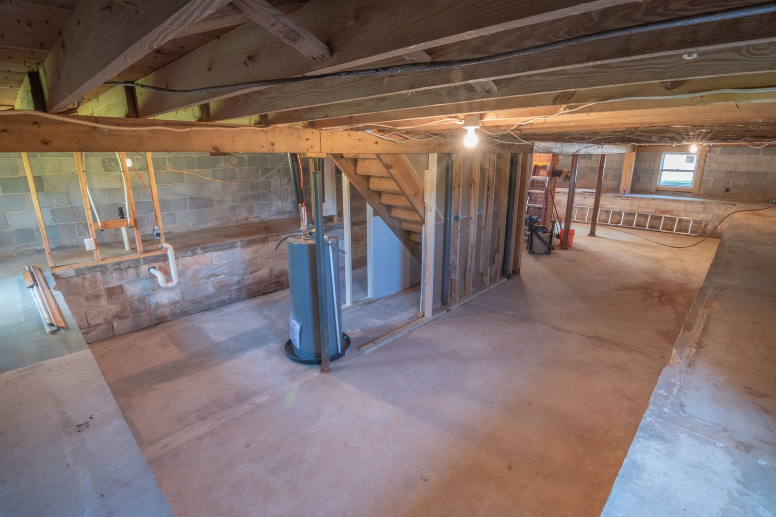 A sump pump sitting in a basement sump pit